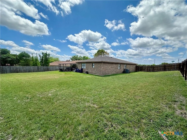 view of yard with a fenced backyard and a gazebo