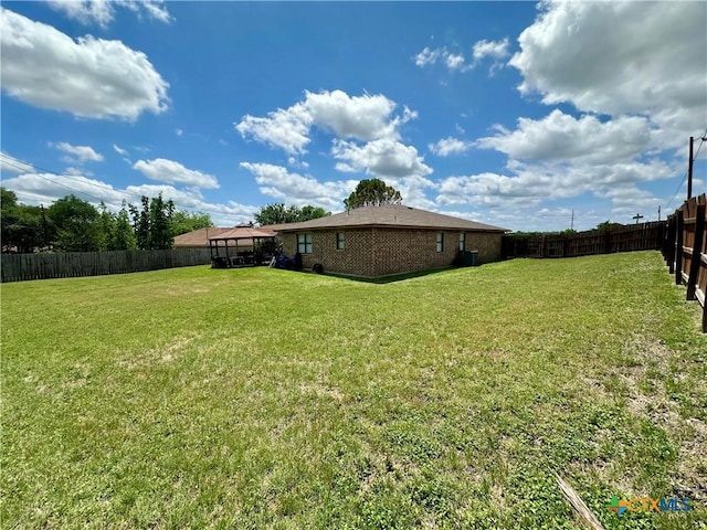 view of yard with a fenced backyard and a gazebo