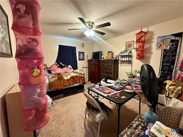 bedroom featuring a textured ceiling, carpet flooring, and ceiling fan