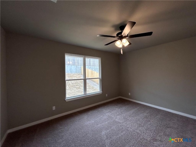 spare room featuring carpet floors and ceiling fan