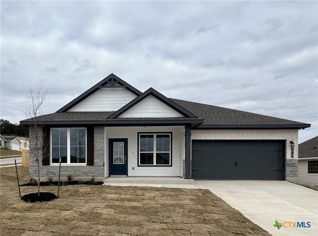 view of front of house with a garage and a front yard