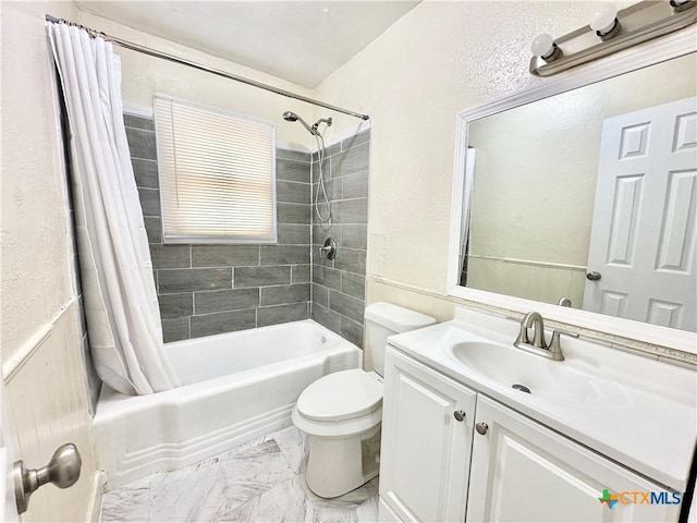 full bathroom featuring shower / bath combination with curtain, vanity, and toilet