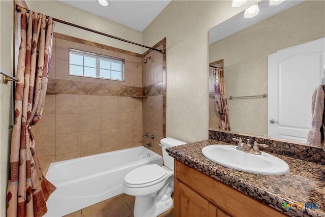 full bathroom featuring toilet, shower / bath combo, vanity, and tile patterned floors