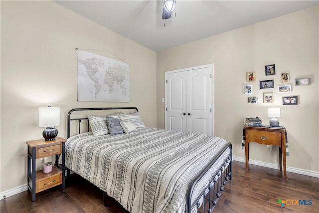 bedroom with ceiling fan, dark hardwood / wood-style flooring, and a closet