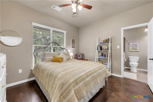 bedroom with dark hardwood / wood-style flooring, ensuite bathroom, and ceiling fan