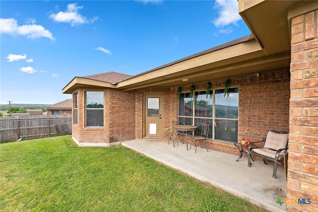 2006 Jesse Dr, Copperas Cove, TX 76522 - back of house featuring fence, a lawn, a patio area, and brick siding