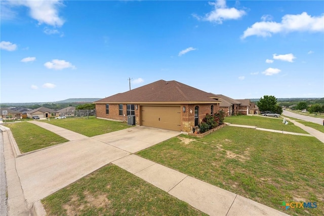 2006 Jesse Dr, Copperas Cove, TX 76522 - view of front of house featuring brick siding, driveway, a front lawn, and a garage