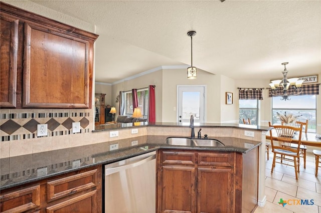 2006 Jesse Dr, Copperas Cove, TX 76522 - kitchen with hanging light fixtures, a sink, dishwasher, a chandelier, and dark stone counters