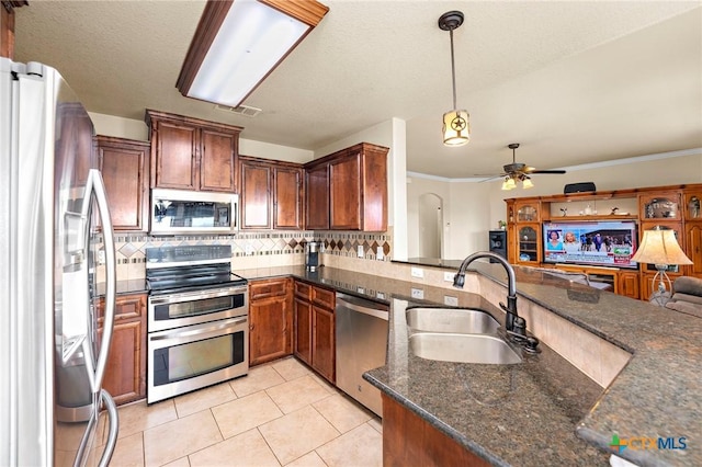 2006 Jesse Dr, Copperas Cove, TX 76522 - kitchen with ceiling fan, tasteful backsplash, a sink, stainless steel appliances, and light tile patterned flooring