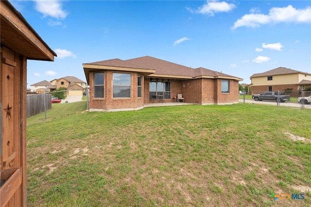 2006 Jesse Dr, Copperas Cove, TX 76522 - rear view of property with brick siding, a fenced backyard, a patio area, and a yard