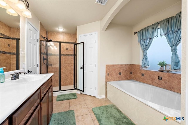 2006 Jesse Dr, Copperas Cove, TX 76522 - full bath featuring vanity, tile patterned flooring, visible vents, a bath, and a shower stall