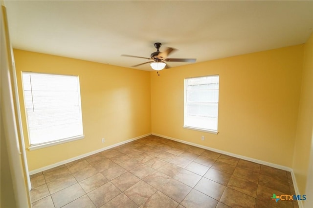 103 Royal Dr, Victoria, TX 77901 - tiled empty room featuring a ceiling fan and baseboards