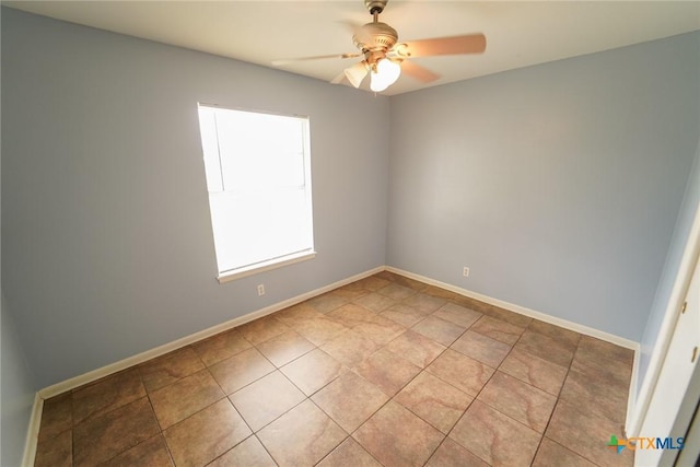 103 Royal Dr, Victoria, TX 77901 - unfurnished room featuring light tile patterned floors, a ceiling fan, and baseboards