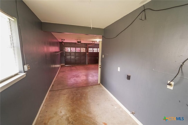 103 Royal Dr, Victoria, TX 77901 - corridor with baseboards, concrete flooring, and plenty of natural light