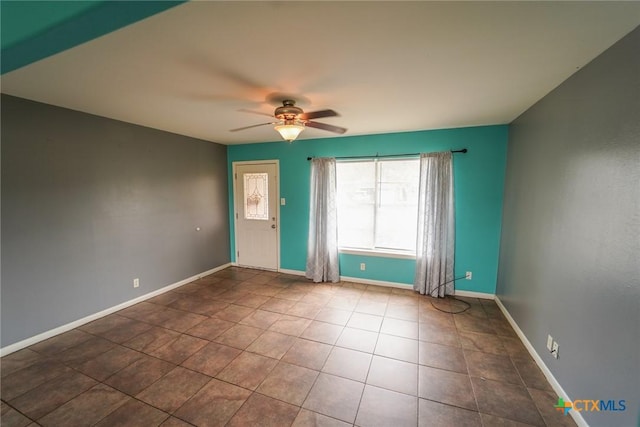 103 Royal Dr, Victoria, TX 77901 - empty room with ceiling fan, tile patterned flooring, and baseboards