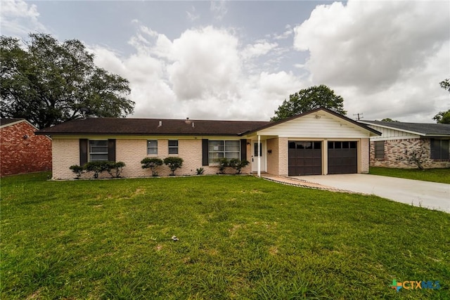 103 Royal Dr, Victoria, TX 77901 - ranch-style house featuring a garage, concrete driveway, a front yard, and brick siding