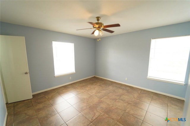 103 Royal Dr, Victoria, TX 77901 - tiled empty room featuring ceiling fan and baseboards