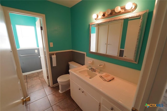 103 Royal Dr, Victoria, TX 77901 - half bathroom with vanity, toilet, and tile patterned floors