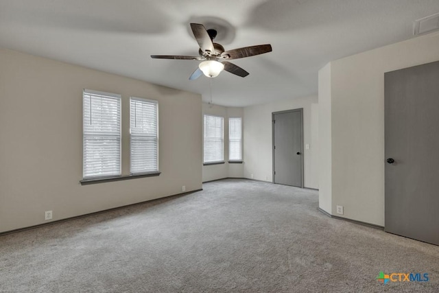 unfurnished bedroom featuring light colored carpet and ceiling fan