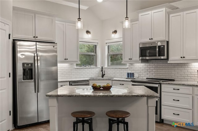 kitchen with appliances with stainless steel finishes, backsplash, and a sink