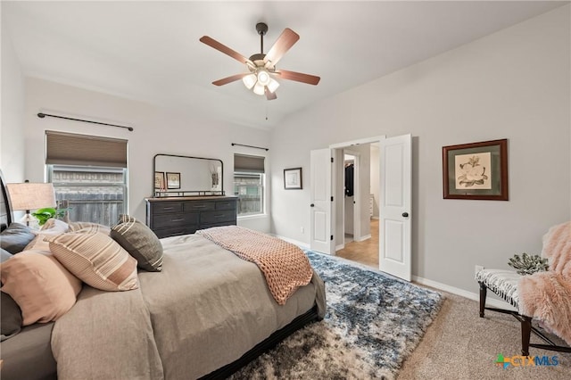 carpeted bedroom with ceiling fan, multiple windows, lofted ceiling, and baseboards