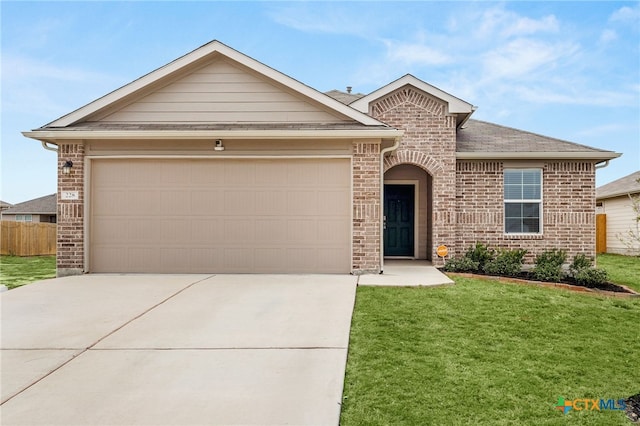 single story home with a front yard and a garage