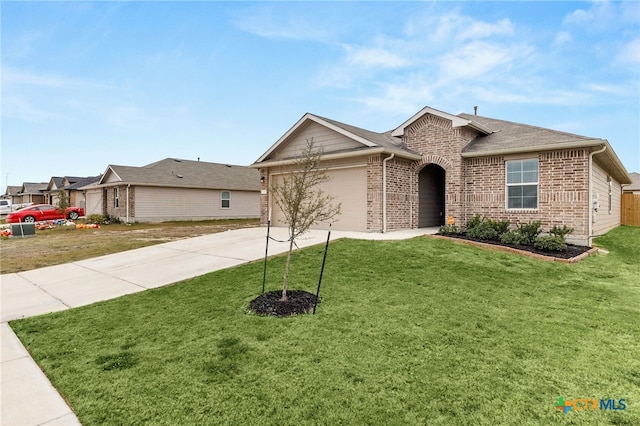 ranch-style home featuring a front lawn and a garage