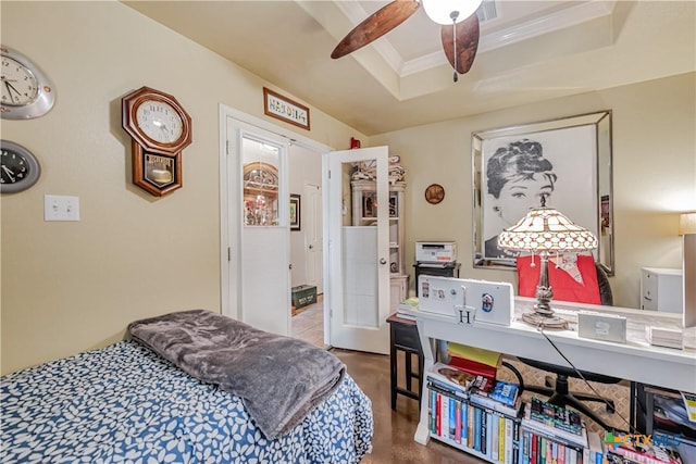 bedroom featuring a tray ceiling, crown molding, finished concrete floors, and a desk