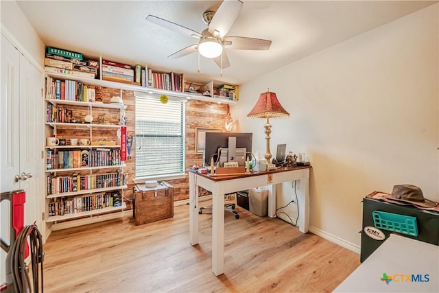 office with wood finished floors, ceiling fan, and baseboards