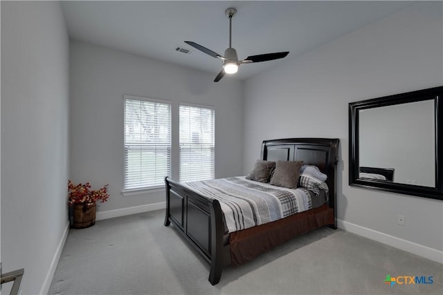 3935 Outpost Trce, Lago Vista, TX 78645 - bedroom featuring light carpet, baseboards, and ceiling fan