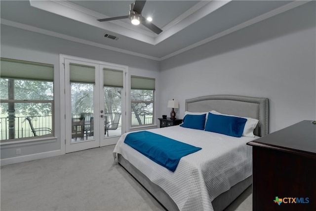 3935 Outpost Trce, Lago Vista, TX 78645 - bedroom with french doors, a tray ceiling, access to outside, ornamental molding, and carpet flooring