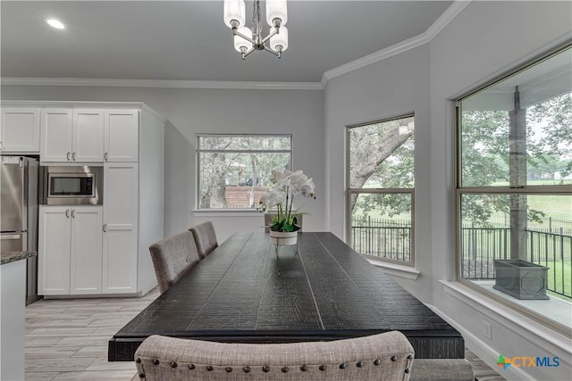 3935 Outpost Trce, Lago Vista, TX 78645 - dining space with a chandelier, crown molding, and light wood-style floors