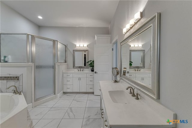 3935 Outpost Trce, Lago Vista, TX 78645 - bathroom with a stall shower, a garden tub, marble finish floors, two vanities, and recessed lighting
