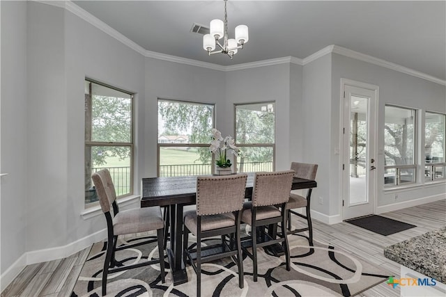 3935 Outpost Trce, Lago Vista, TX 78645 - dining space featuring plenty of natural light, a chandelier, baseboards, and ornamental molding