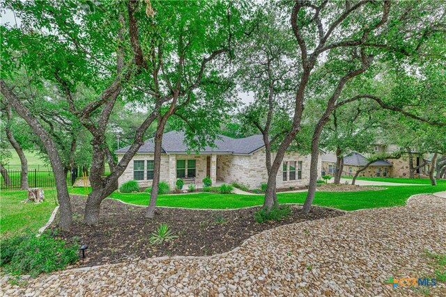 3935 Outpost Trce, Lago Vista, TX 78645 - view of front of house featuring brick siding and a shingled roof
