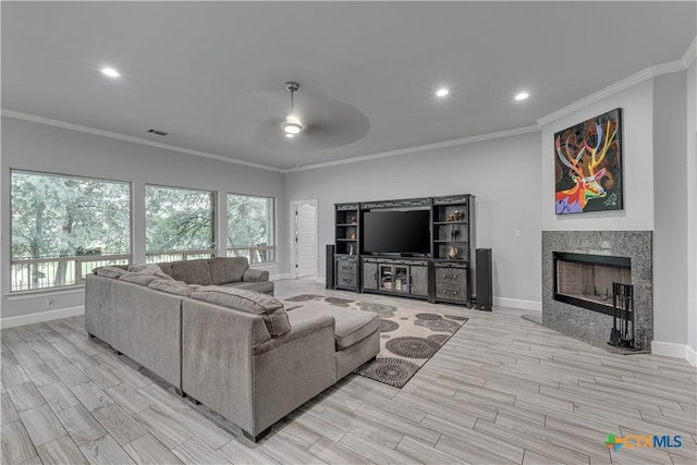3935 Outpost Trce, Lago Vista, TX 78645 - living area featuring a ceiling fan, ornamental molding, healthy amount of natural light, baseboards, and recessed lighting