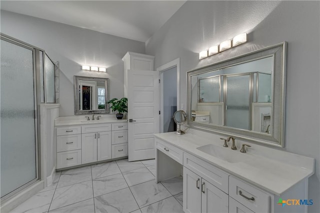 3935 Outpost Trce, Lago Vista, TX 78645 - bathroom with a shower stall, marble finish flooring, and two vanities