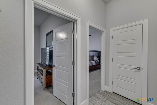 3935 Outpost Trce, Lago Vista, TX 78645 - hallway featuring baseboards