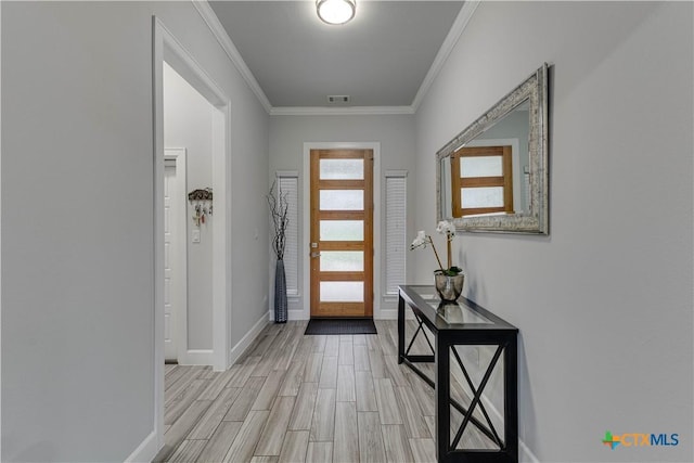 3935 Outpost Trce, Lago Vista, TX 78645 - foyer featuring light wood finished floors, crown molding, and baseboards