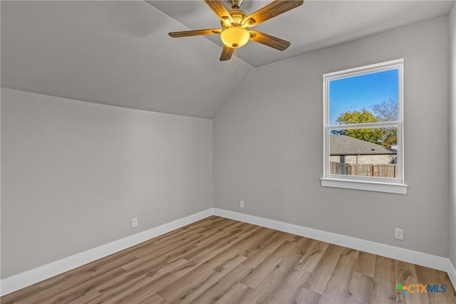 additional living space featuring ceiling fan, lofted ceiling, and light hardwood / wood-style flooring