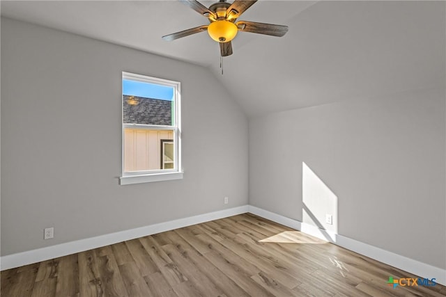 bonus room with lofted ceiling, ceiling fan, and light wood-type flooring