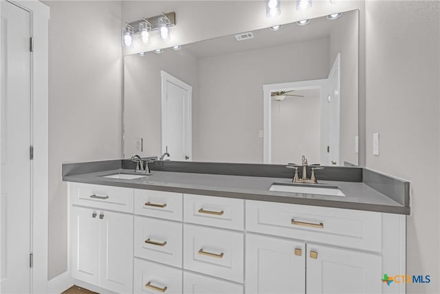 bathroom featuring ceiling fan and vanity