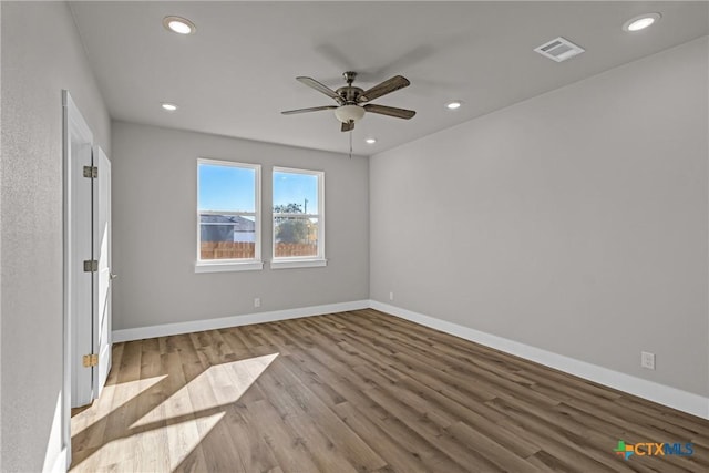 empty room featuring light wood-type flooring and ceiling fan