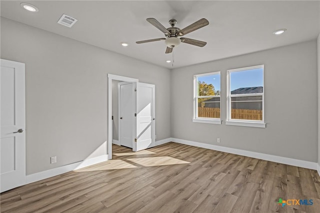 unfurnished bedroom with light hardwood / wood-style floors and ceiling fan