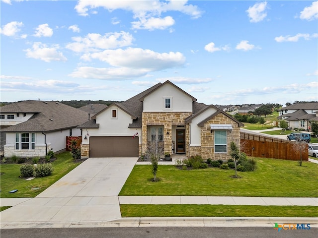 view of front facade with a garage and a front lawn