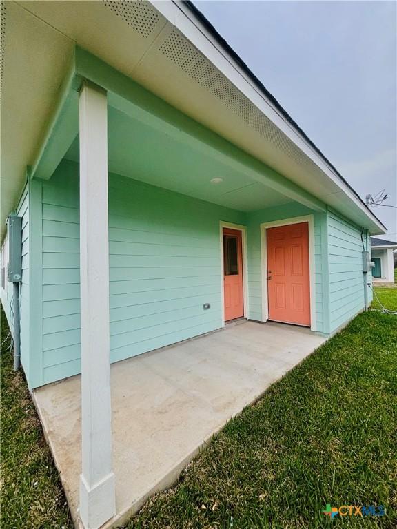 exterior space featuring a patio and a front yard