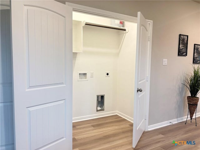 laundry room featuring light wood-style flooring, laundry area, electric dryer hookup, and baseboards