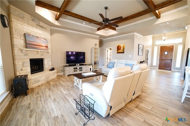 living room featuring a ceiling fan, wood finished floors, visible vents, coffered ceiling, and beam ceiling