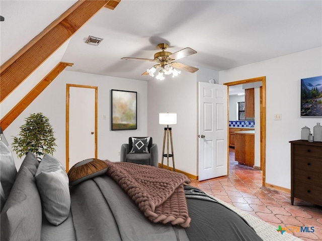 tiled bedroom featuring ceiling fan