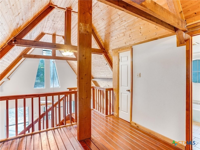 additional living space featuring high vaulted ceiling, wood ceiling, hardwood / wood-style flooring, and beam ceiling